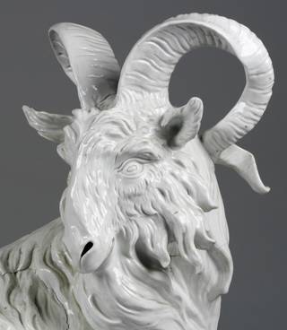 Porcelain long-haired goat figure with horns