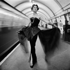 Barbara Goalen in evening dress in the Underground
