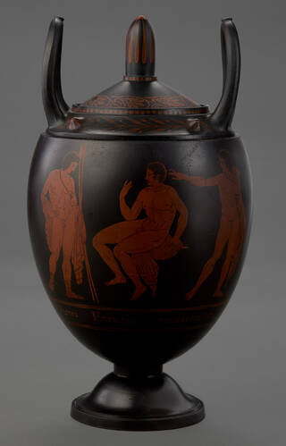 Black and terracotta coloured vase with handles